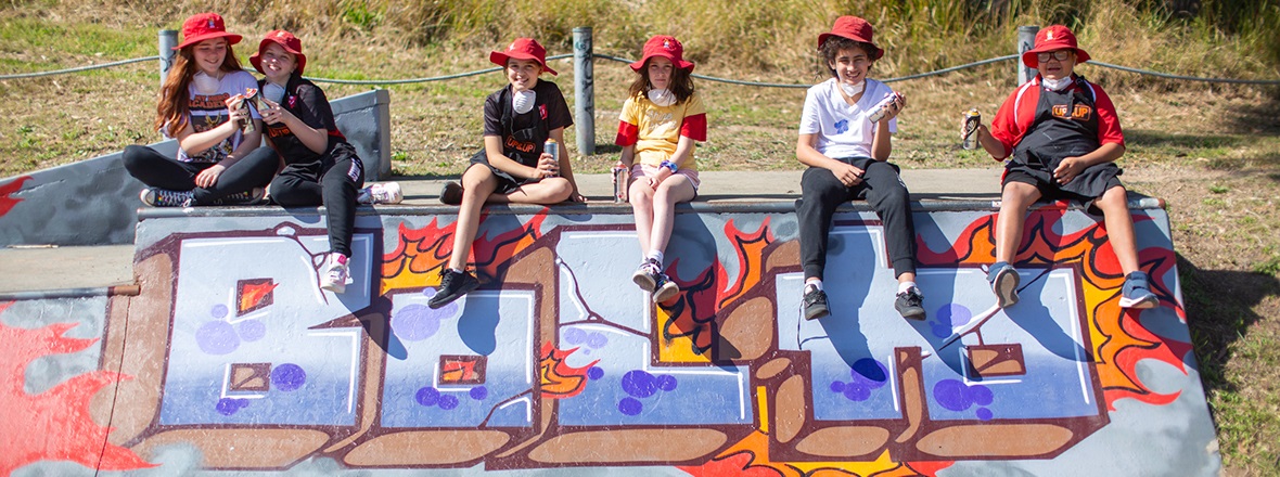 Fennell Bay Public School students with their artwork banner.jpg