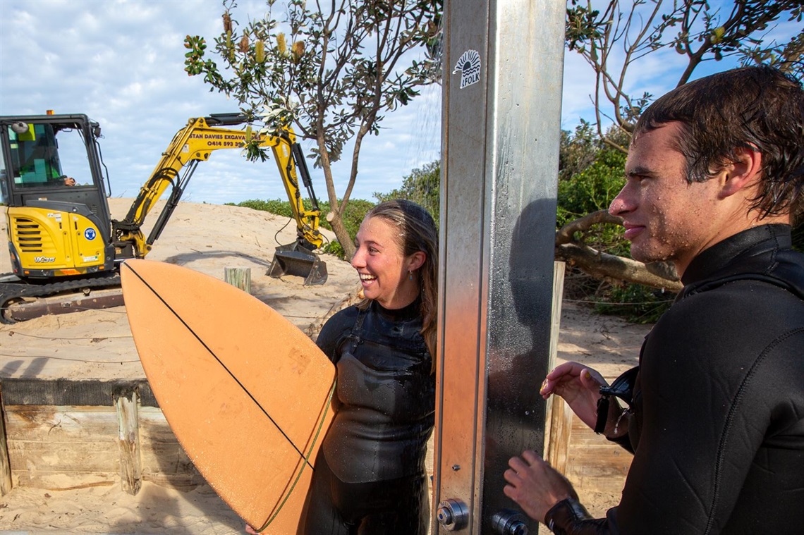 Surfers Chenoa Scott and Lukas Edwards enjoying the newly cleared Redhead Beach showers.jpg