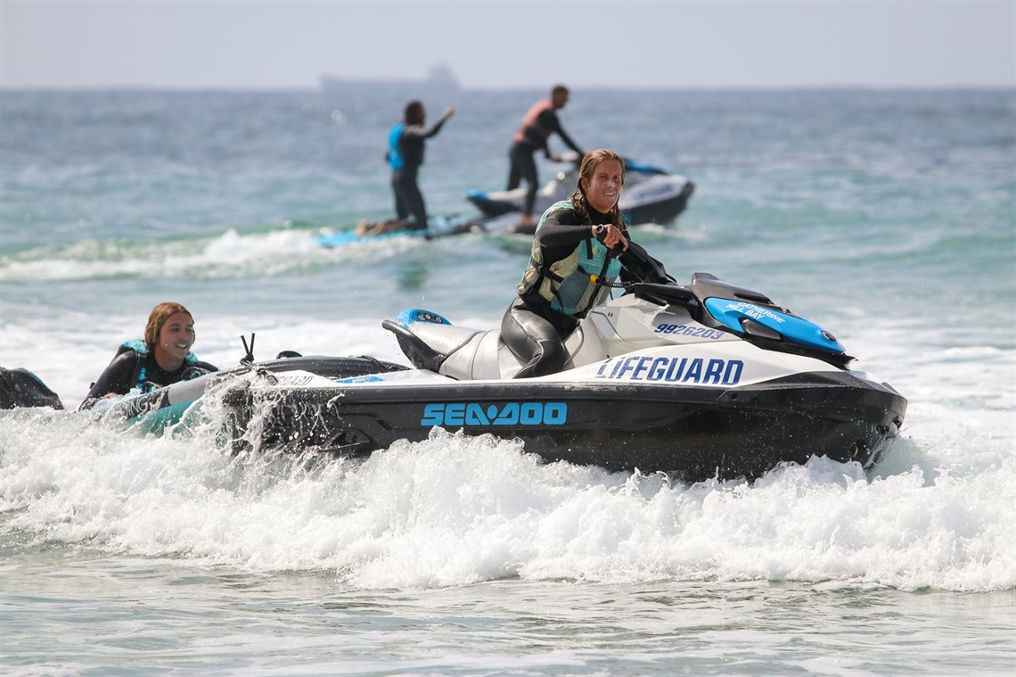 Teighan Marshall tows Zac McMahon on a jet-ski off Caves Beach.jpg