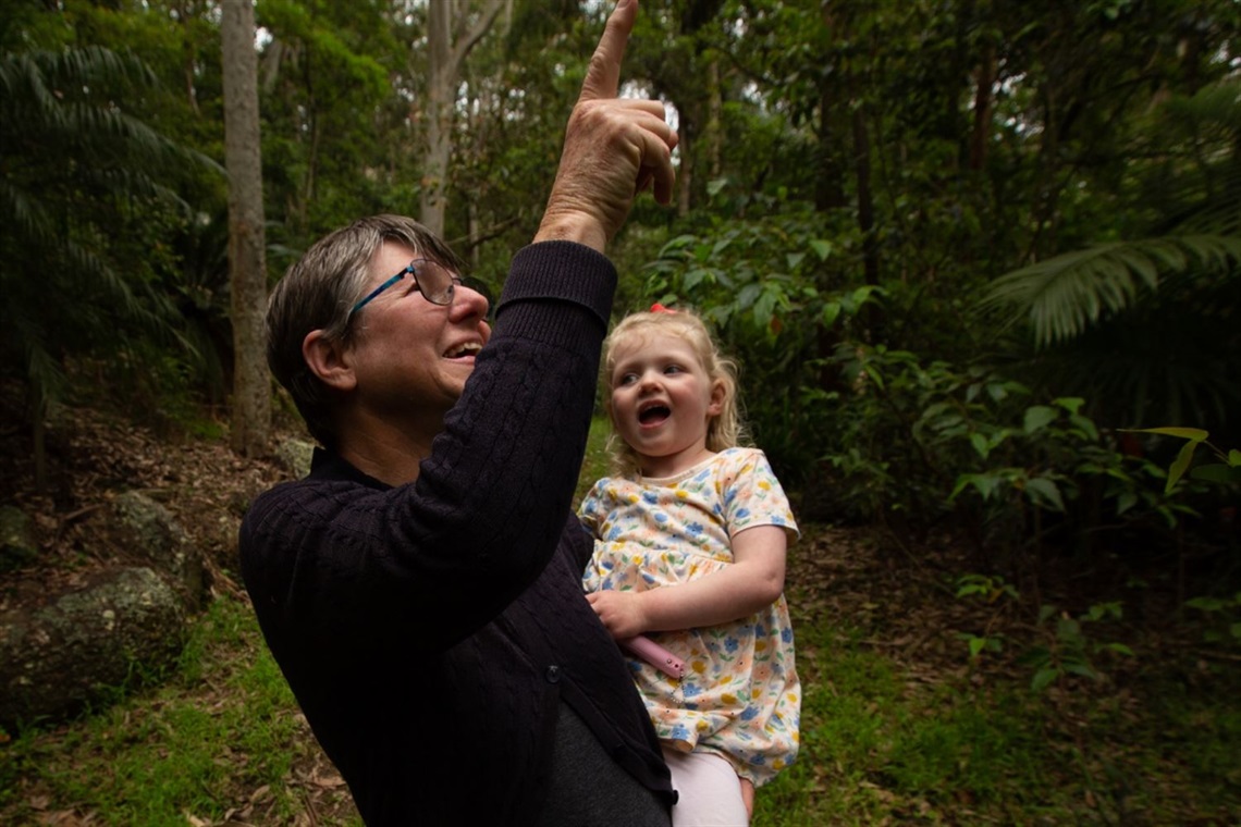 Maya Guest with granddaughter Ellie, 2, spotting birds on her Warners Bay property.jpg