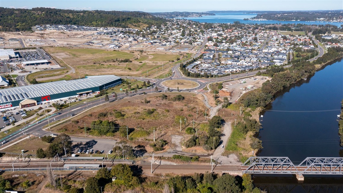 Aerial photo showing the Council-owned land near Cockle Creek station in the foreground, and NSW Government-owned land behind.jpg