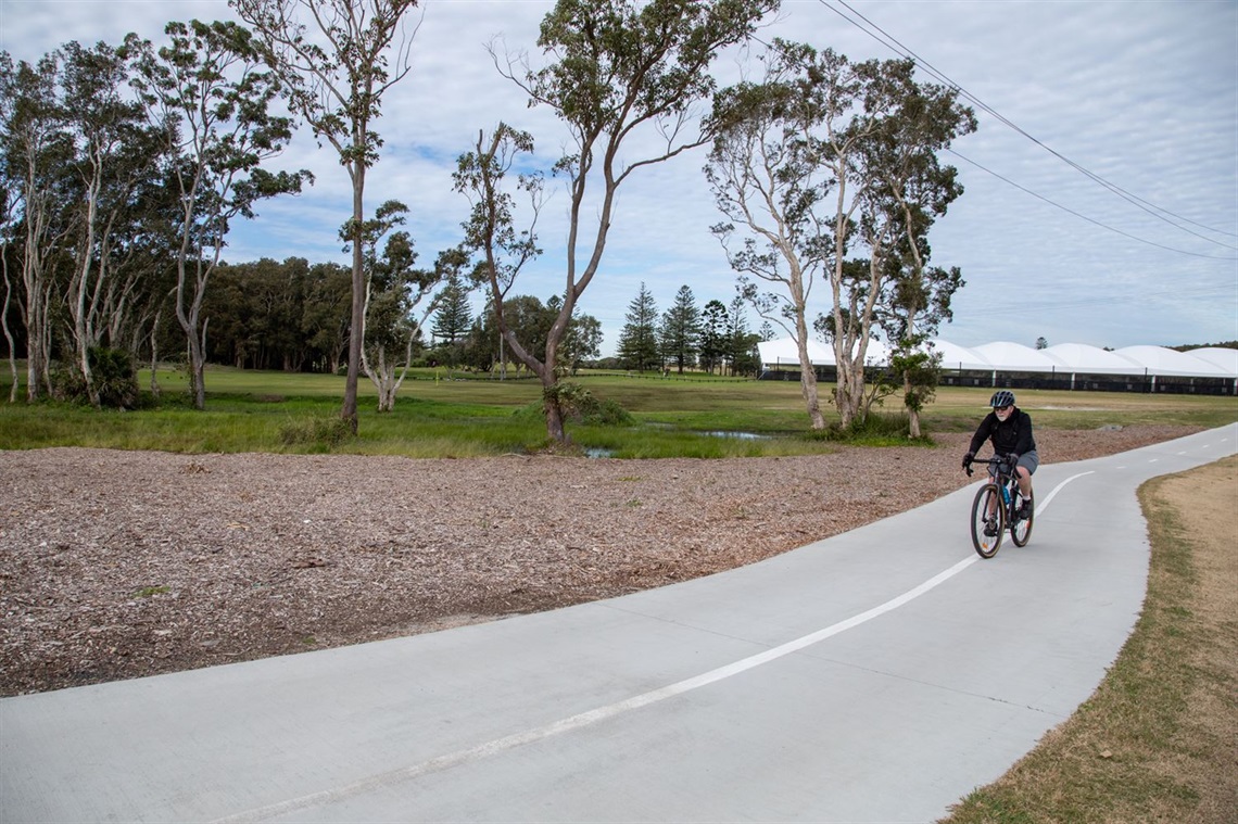 A cyclist using the FAST middle section near the Belmont Golf and Bowls driving range.jpg