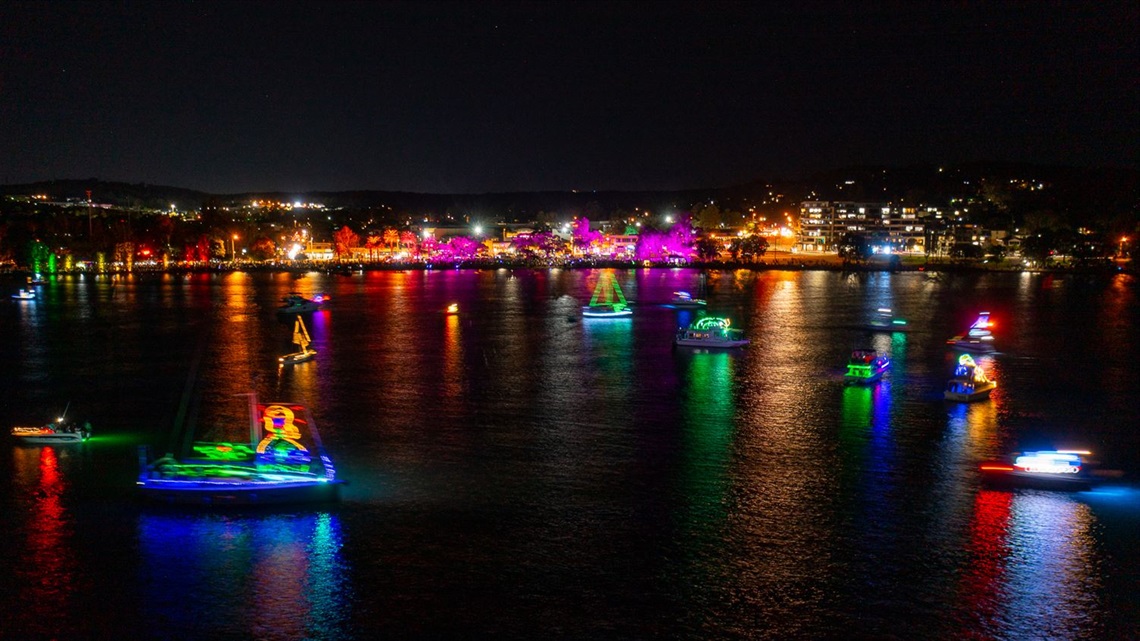 Some of the boats passing by Warners Bay on Saturday night.jpg