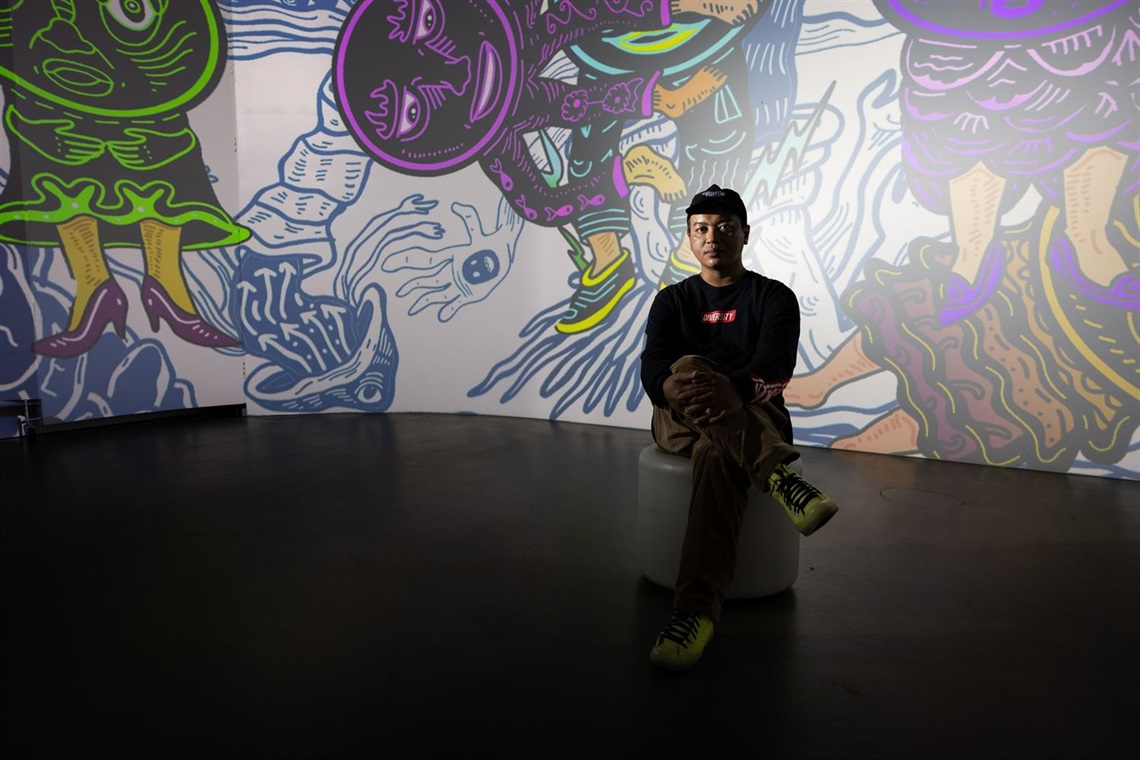 Kultura Collective artist Dias Prabu in front of the immersive artwork at MAP mima.jpg