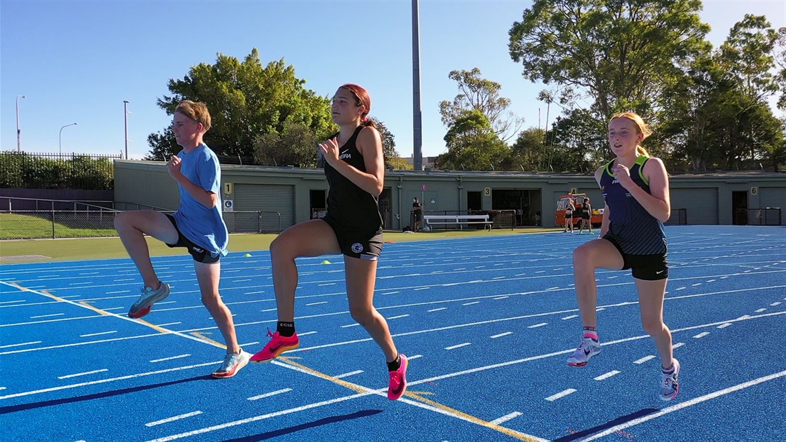 Thomas Cashion, Keira Carlson and Lacy Barnes warming up during training at Hunter Sports Centre.jpg