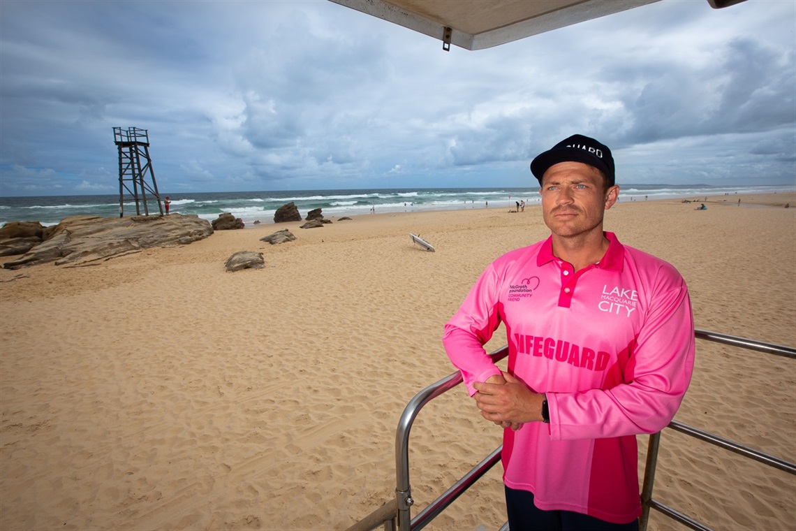 Senior Lifeguard Lucas Samways in his breast cancer awareness shirt at Redhead Beach.jpg