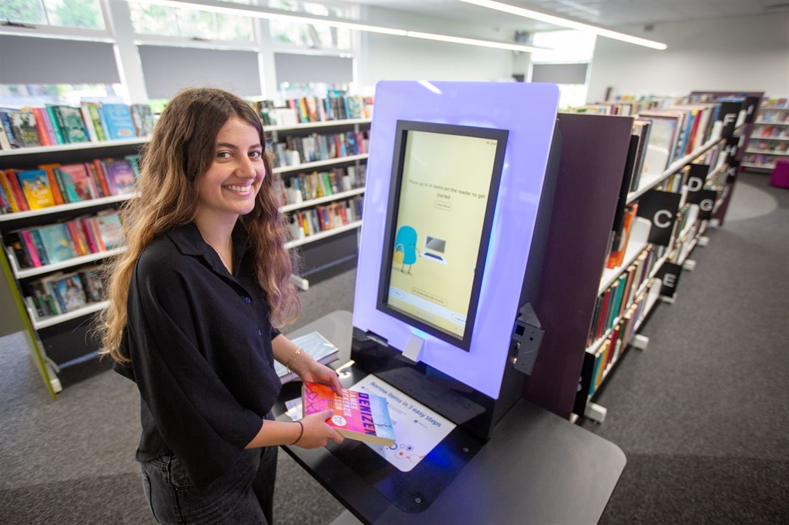Bookworm Dani Marrett uses the self-access service at Speers Point Library, milyaba.jpg