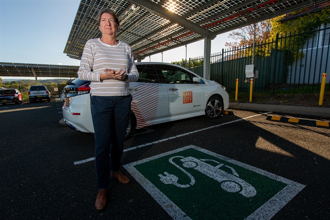 Sustainability Engagement Coordinator Chris Harle with some of Council's EVs.jpg