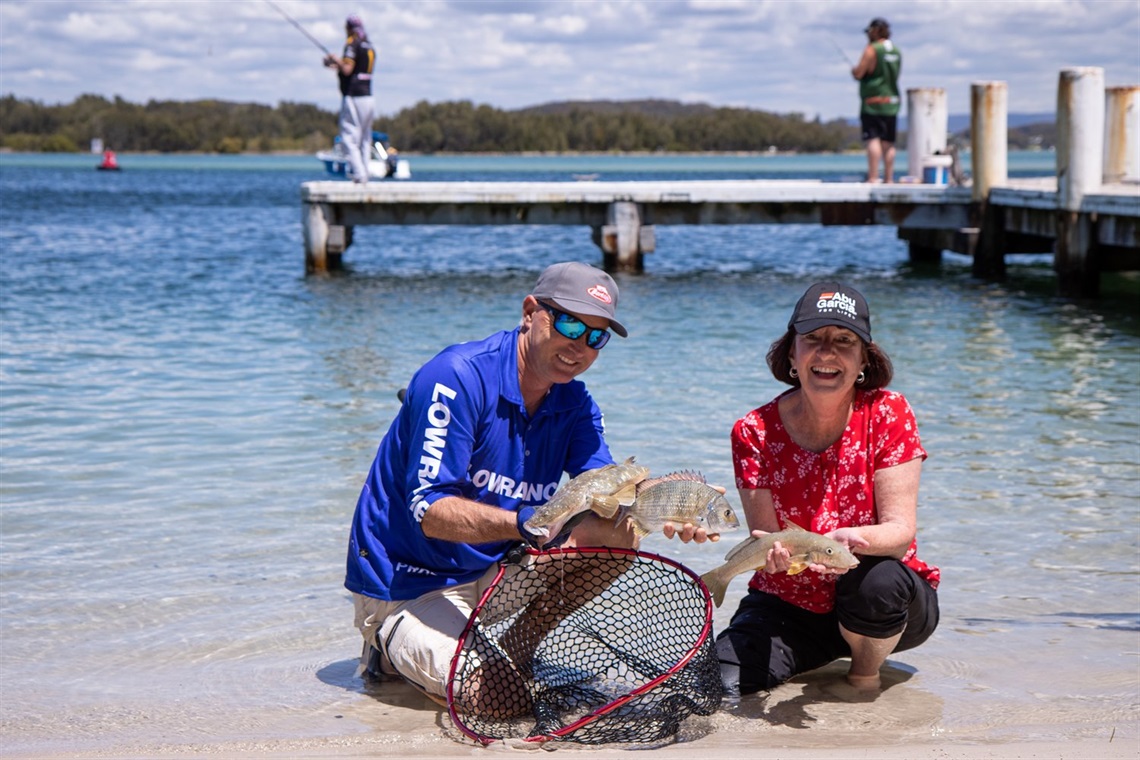 Let's Fish organiser Michael Guest and Mayor Kay Fraser with three of the four target species.jpg