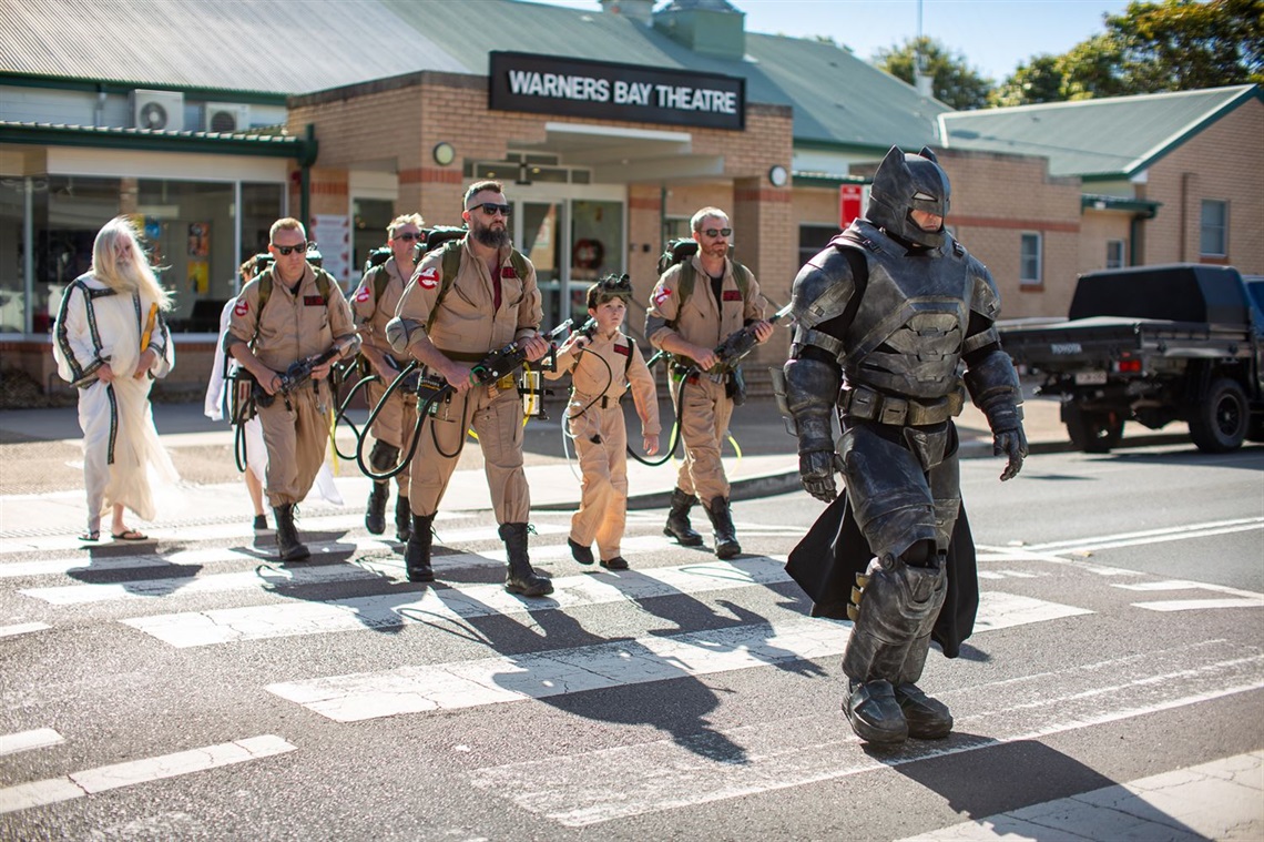 Cosplay characters, including Batman and Ghostbusters, preparing for Lake Mac's Pop Bam festival.jpg