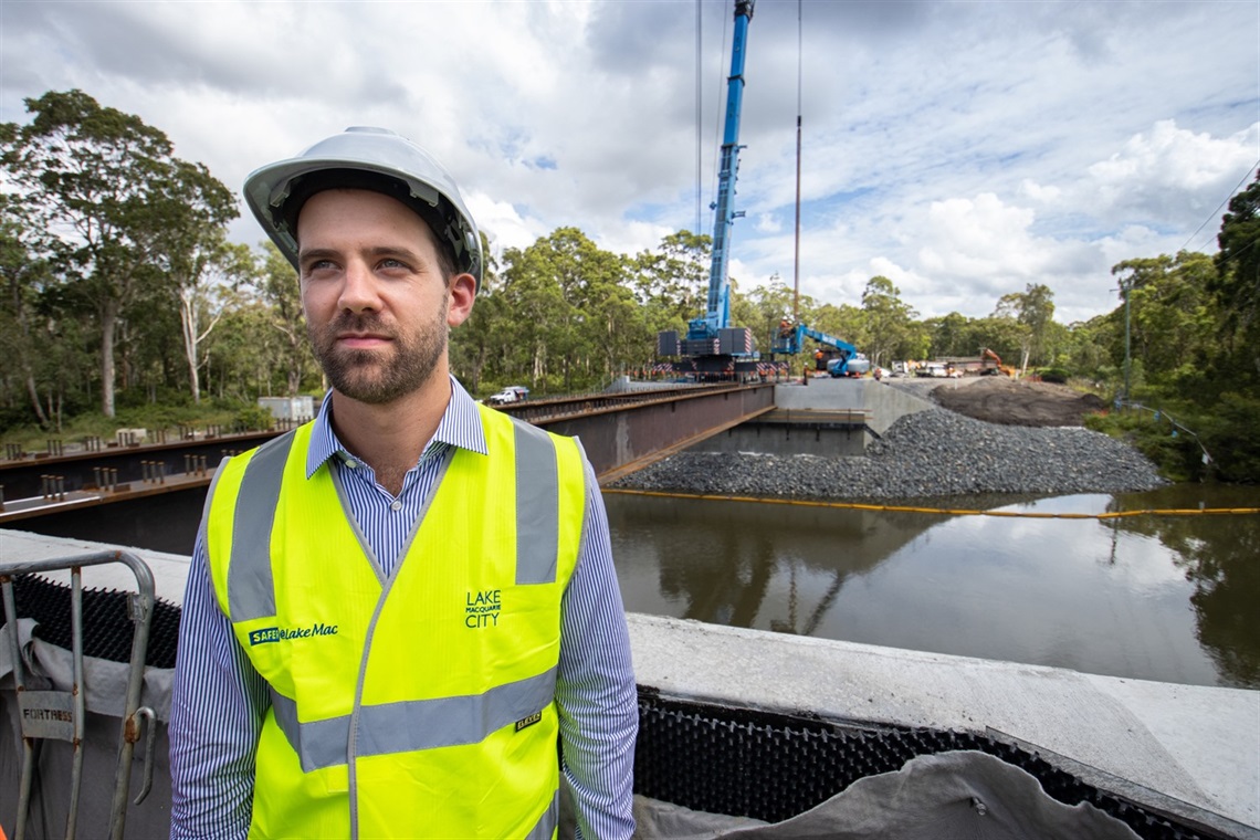 Special Projects Officer Micah Barnes at the Weir Road bridge construction site.jpg