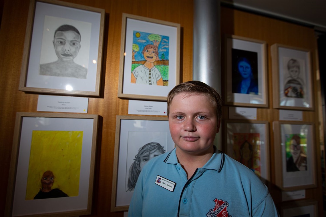 Ashton Soper, 11, with a portrait of his cousin.jpg