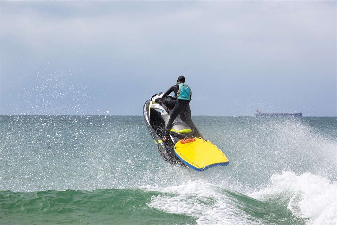 Senior Beach Lifeguard Troy Ham demonstrating the abilities of the jet-ski.jpg